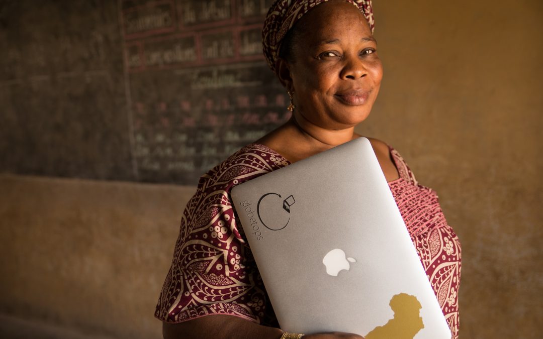 School principal Mariama Bangoura moments after receiving her first Macbook Air.