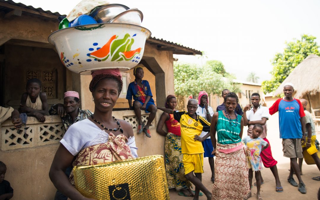 A village woman and her crew in Kenende, Guinea.