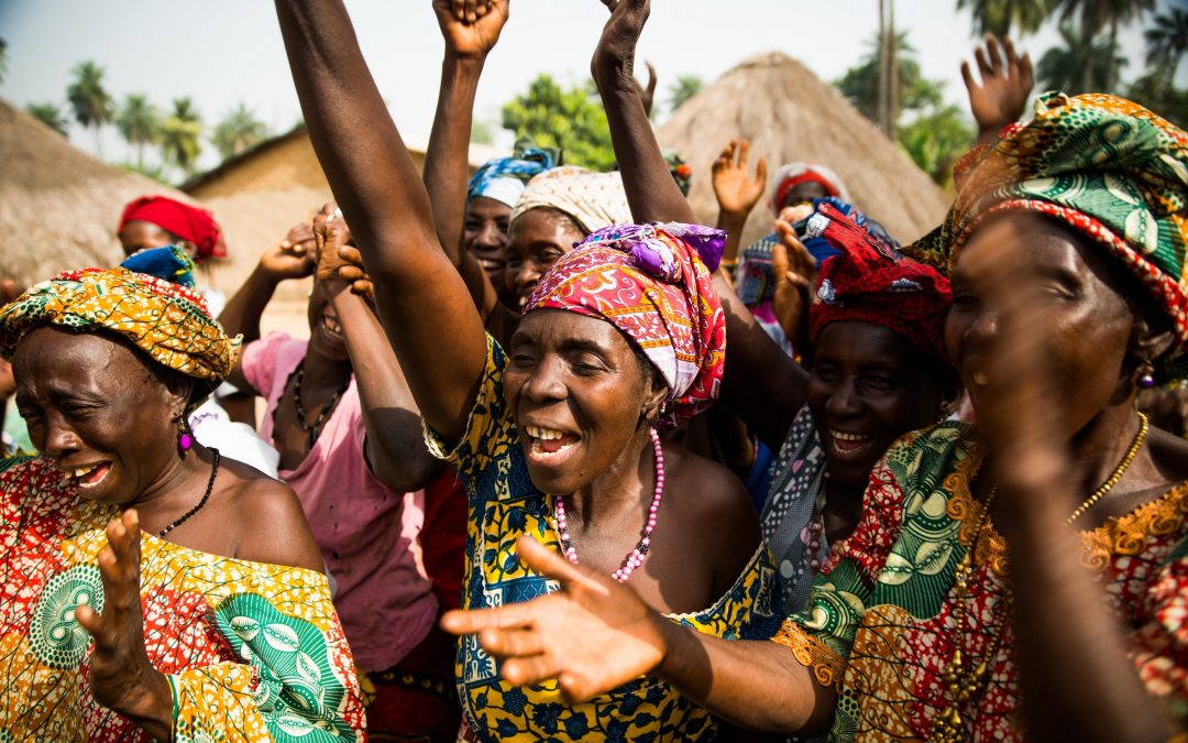 Village women leading the redistribution revolution in Kenende, Guinea.