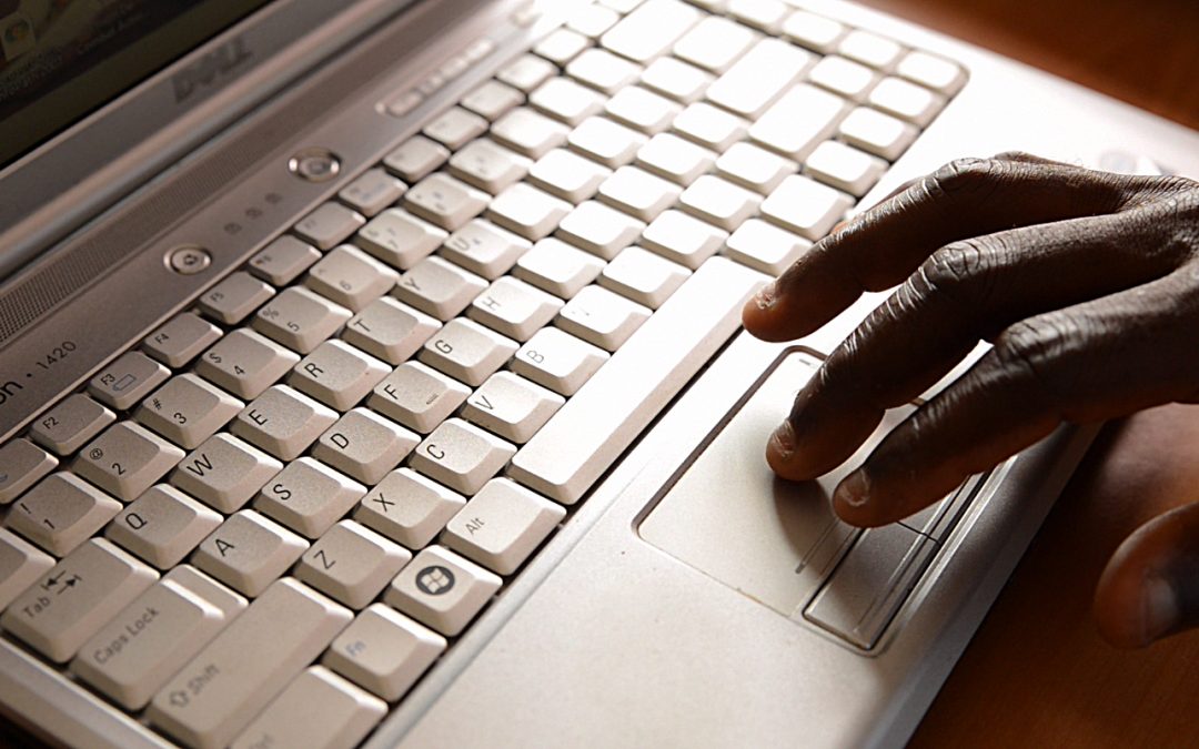Seydouba Sylla on his computer in Conakry, Guinea.